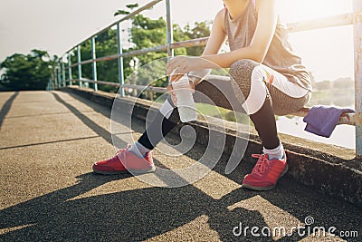 Sport woman sitting after running Stock Photo