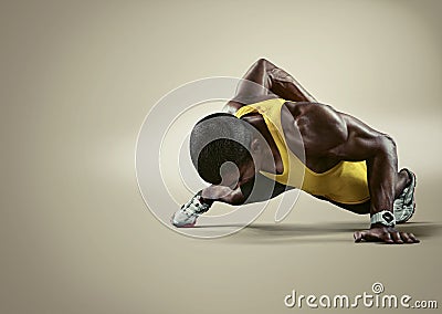 Sport. Young athletic man doing push-ups Stock Photo