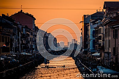 sporty people have fun with canoe at Navigli Milano Italy winter xmas time Stock Photo