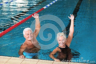 Sportive senior couple doing exercises Stock Photo