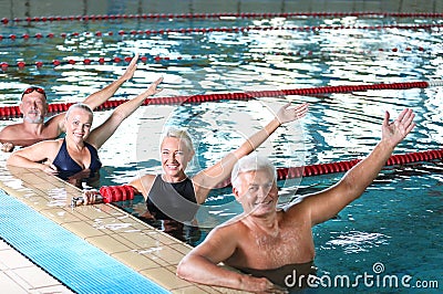 Sportive senior people doing exercises Stock Photo