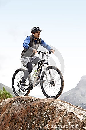 Sports, athlete and a man on a bike on the mountain for cycling, training and travel in nature. Idea, health and a male Stock Photo