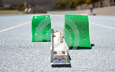 Sports, athletics and start block on track in outdoor stadium for running, marathon and sprint racing. Fitness, training Stock Photo