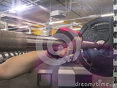 Sports background. Young girl getting ready for weight lifting training. Stock Photo