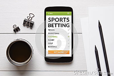 Sports betting concept on smart phone screen with office objects Stock Photo