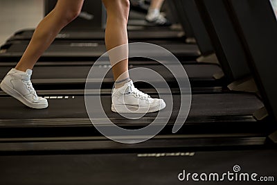 Sports blonde women on running track. female athlete on treadmill Stock Photo