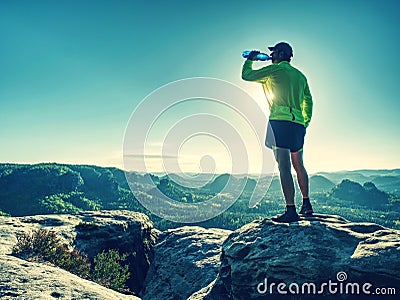 Sports bottle drink sport man drinking water on trail run Stock Photo