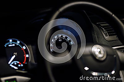 Car inside gray seats red dashboard night photography in the dark Stock Photo