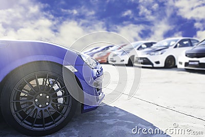 Sports car and Used cars, parked in the parking lot of Dealership waiting to be sold and delivered to customers and waiting for Stock Photo