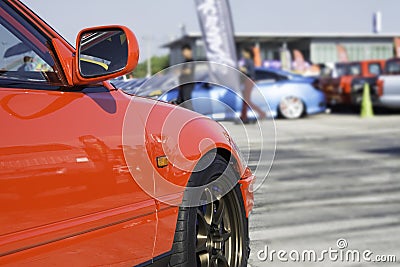 Sports car and Used cars, parked in the parking lot of Dealership waiting to be sold and delivered to customers and waiting for Stock Photo