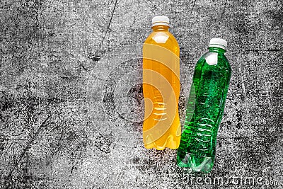 Sports Energy Drinks, sport beverage on a gray concrete background. It usually contains salt and sugar and maintains optimal Stock Photo