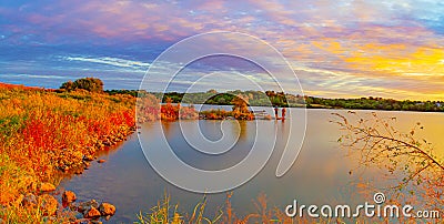 Sports Fishermen at Sunset early fall with beautiful skyline over Ed Zorinsky lake Omaha Nebraska Stock Photo