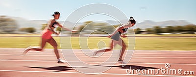 Sports, fitness and relay race with a woman athlete passing a baton to a teammate during a track race. Running, teamwork Stock Photo