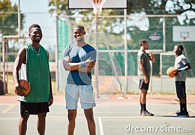 Sports, friends and basketball by basketball player team happy, smile and proud at basketball court. Fitness, men and Stock Photo