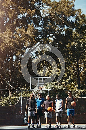 Sports, friends and basketball training at basketball court with group of men walking, talking and bonding before a Stock Photo