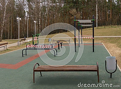 Sports ground that was closed due to the coronavirus pandemic, barrier tape Stock Photo