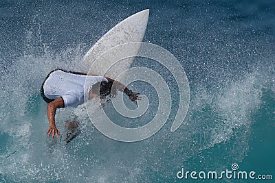 Sports man surfing wave on surfboard Editorial Stock Photo