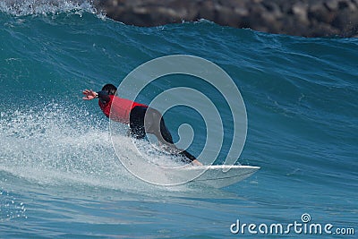 Sports man surfing wave on surfboard Editorial Stock Photo