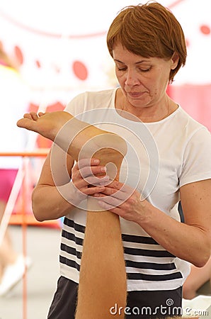 Sports massage therapists work. Editorial Stock Photo