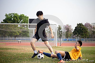 Sports and recreation concept two male soccer players attending regular practice sessions and memorizing attack and defense Stock Photo