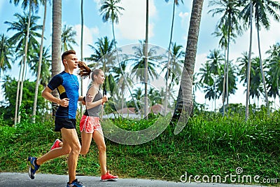 Sports. Runner Couple Running, Jogging On Road. Fitness, Healthy Stock Photo