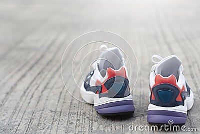 Sports shoes on the floor or street Metaphor Fitness and workout concept exercise Health lifestyle muscle with take care of your Stock Photo