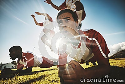 Sports, soccer player and team exercise in cross plank, jump and training at soccer field. Football, fitness and men on Stock Photo