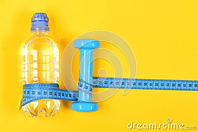 Sports tools in cyan blue. Bottle of water and equipment Stock Photo