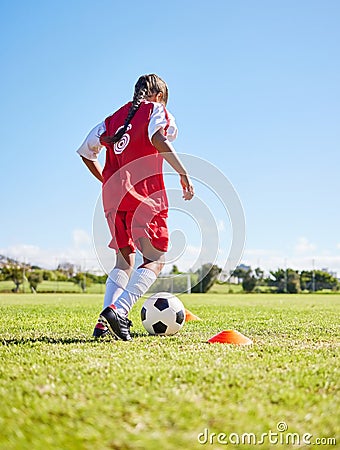 Sports, training and girl playing soccer for fitness, physical activity and hobby on a field in Spain. Active, focus and Stock Photo