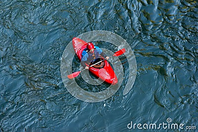 sportsman kayaker comes down on a kayak along the mountain river Belaya in Adygea in the autumn time, the top view Editorial Stock Photo