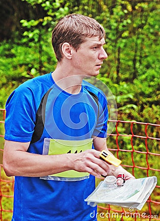 Sportsman on start of orienteering competitions Stock Photo