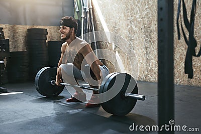 Sportsman Training With Barbell Row At Crossfit Gym Stock Photo