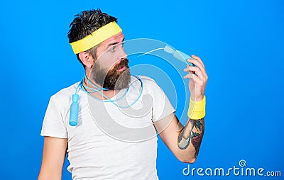 Sportsman training blue background. Athlete training with sport equipment. Gym instructor. Athlete on way to healthier Stock Photo