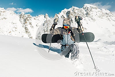 Sportsman walk and fail with snowboard equipment Stock Photo