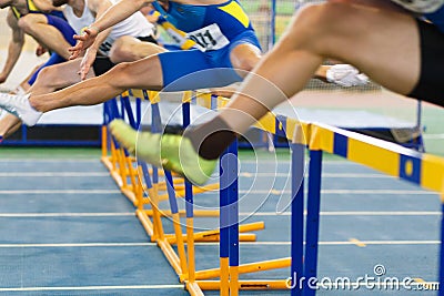 Sportsmen running hurdles sprint race Stock Photo