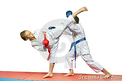 Sportswoman is beating athlete the blow ura mavashi geri on the head Stock Photo