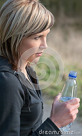 Sportswoman Drinking Water Stock Photo