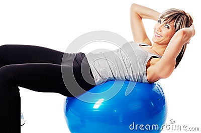Sportswoman exercising on a Fitness Ball Stock Photo