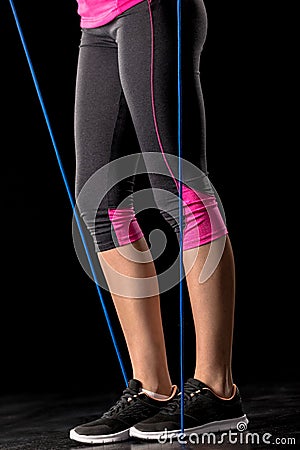 Sportswoman exercising with skipping rope Stock Photo