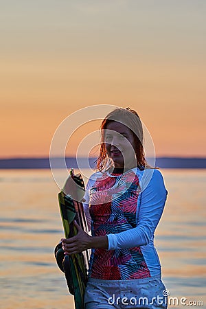 The sportswoman finished the training on wakesurfing. Stock Photo
