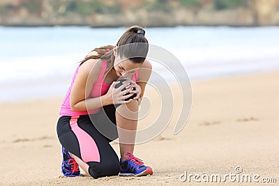 Sportswoman suffering knee ache after running Stock Photo