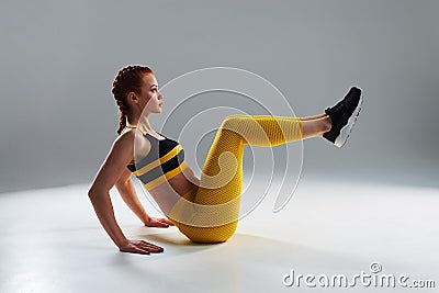 Sportswoman training core muscles Stock Photo