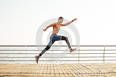 Sporty guy makes a jump in the air Stock Photo