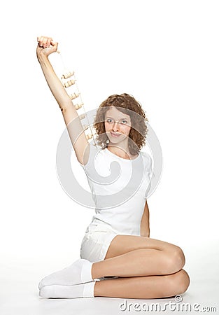 Sporty smiling girl holding massager Stock Photo