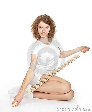 Sporty smiling girl holding massager Stock Photo