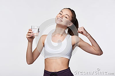 Sporty teen girl with glass of water Stock Photo