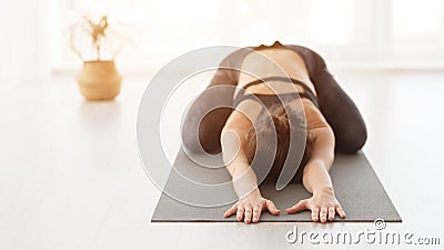 Sporty Woman Doing Child Exercise, Balasana Pose Stock Photo