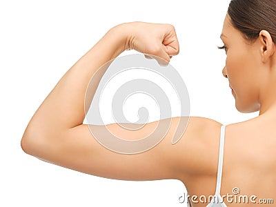 Sporty woman flexing her biceps Stock Photo