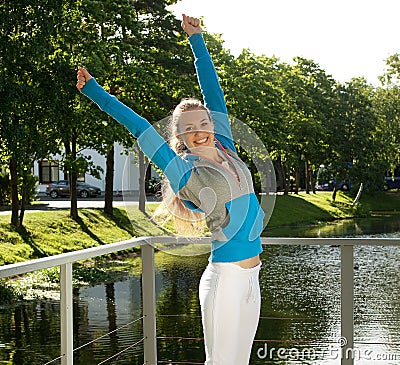 Sporty woman jump outdoor Stock Photo