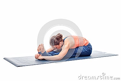 Sporty woman practices Ashtanga Vinyasa yoga asana Stock Photo